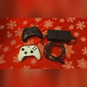 Microsoft Xbox one black 1540 with two controllers and Xbox cable